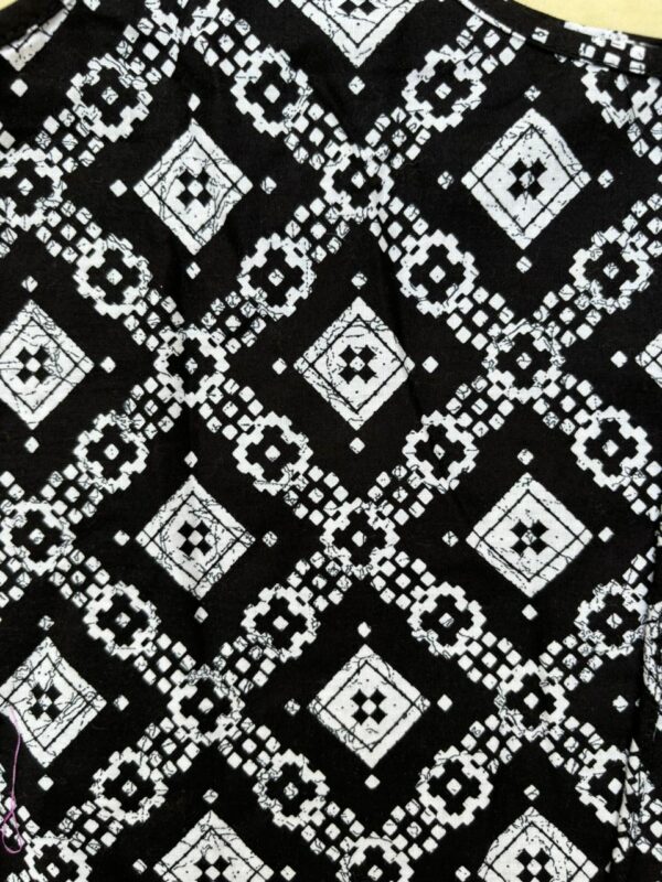Stylish and comfortable, this black printed cotton top features a chic design and soft fabric, making it perfect for casual or everyday wear.