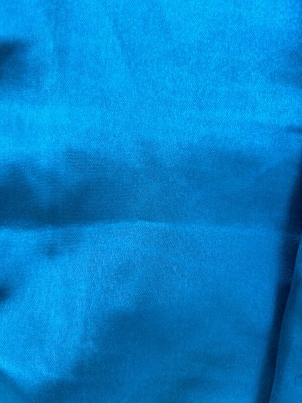 Upgrade your wardrobe with our Blue Satin Top for Women, designed for a sleek and sophisticated look