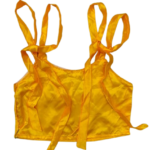 Women's yellow satin top with a smooth, shiny finish, featuring a stylish design and a flattering fit.